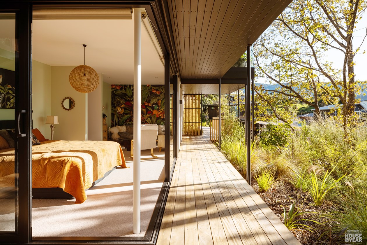 Woodland Escape — Master bedroom opening to deck
